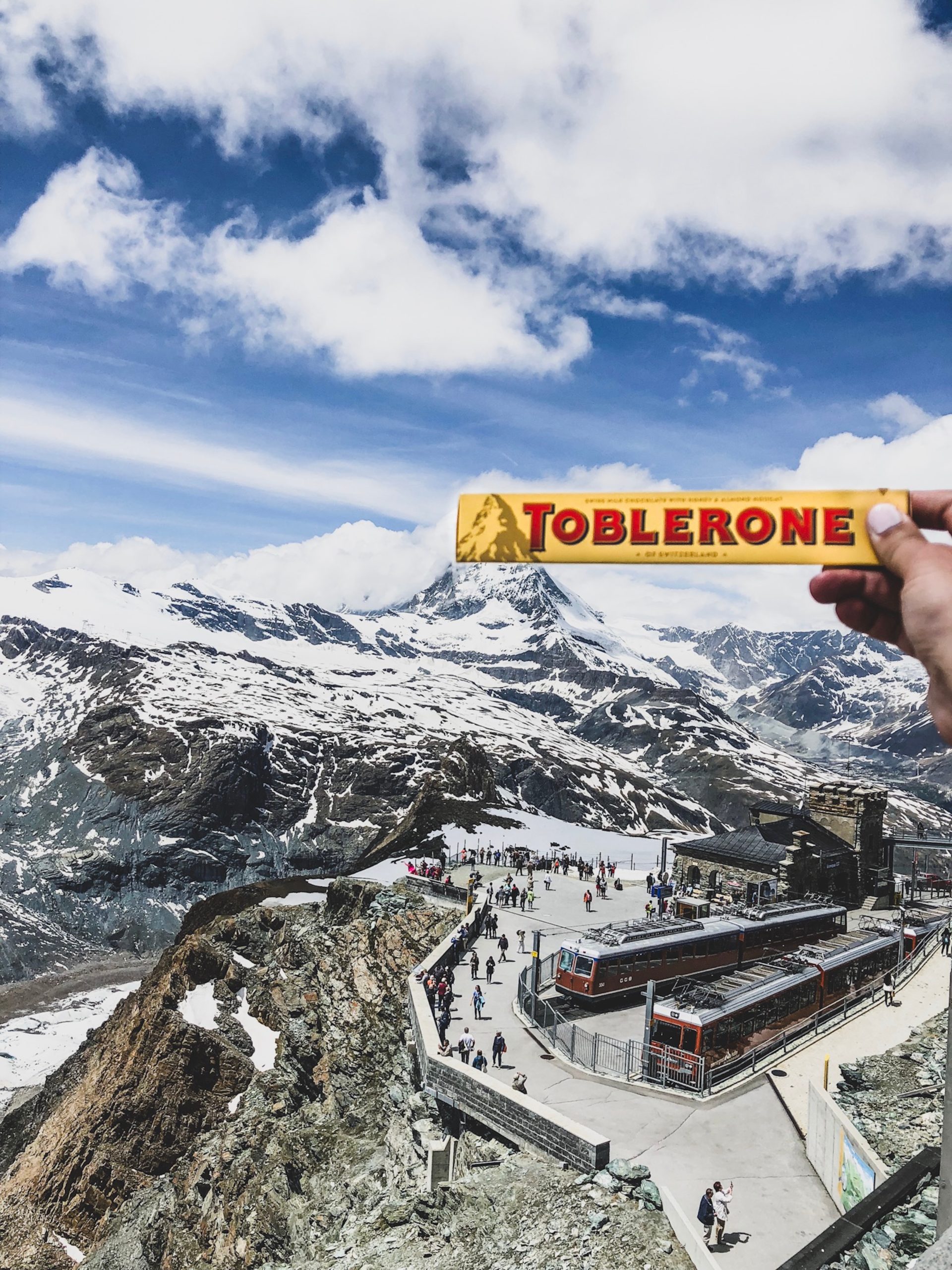 Photo by Morgan Thompson person holding Toblerone chocolate box